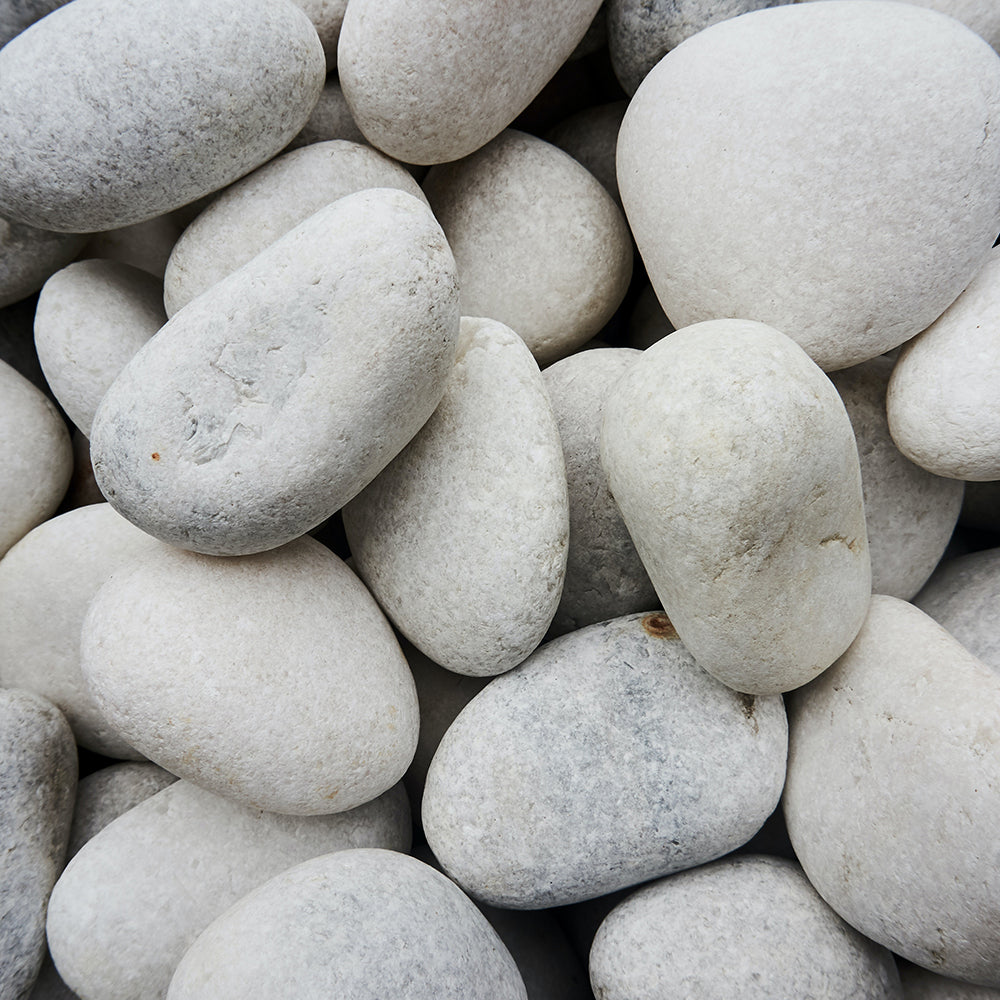 A pile of smooth, river-worn rocks. ATJ Spotify playlist for Simply Unscented.